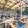 a patio with chairs and tables