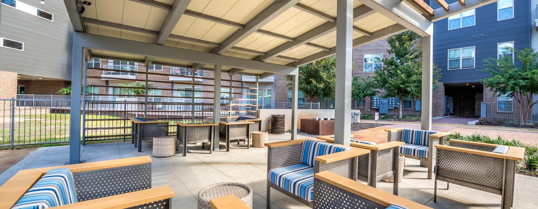 a patio with chairs and tables