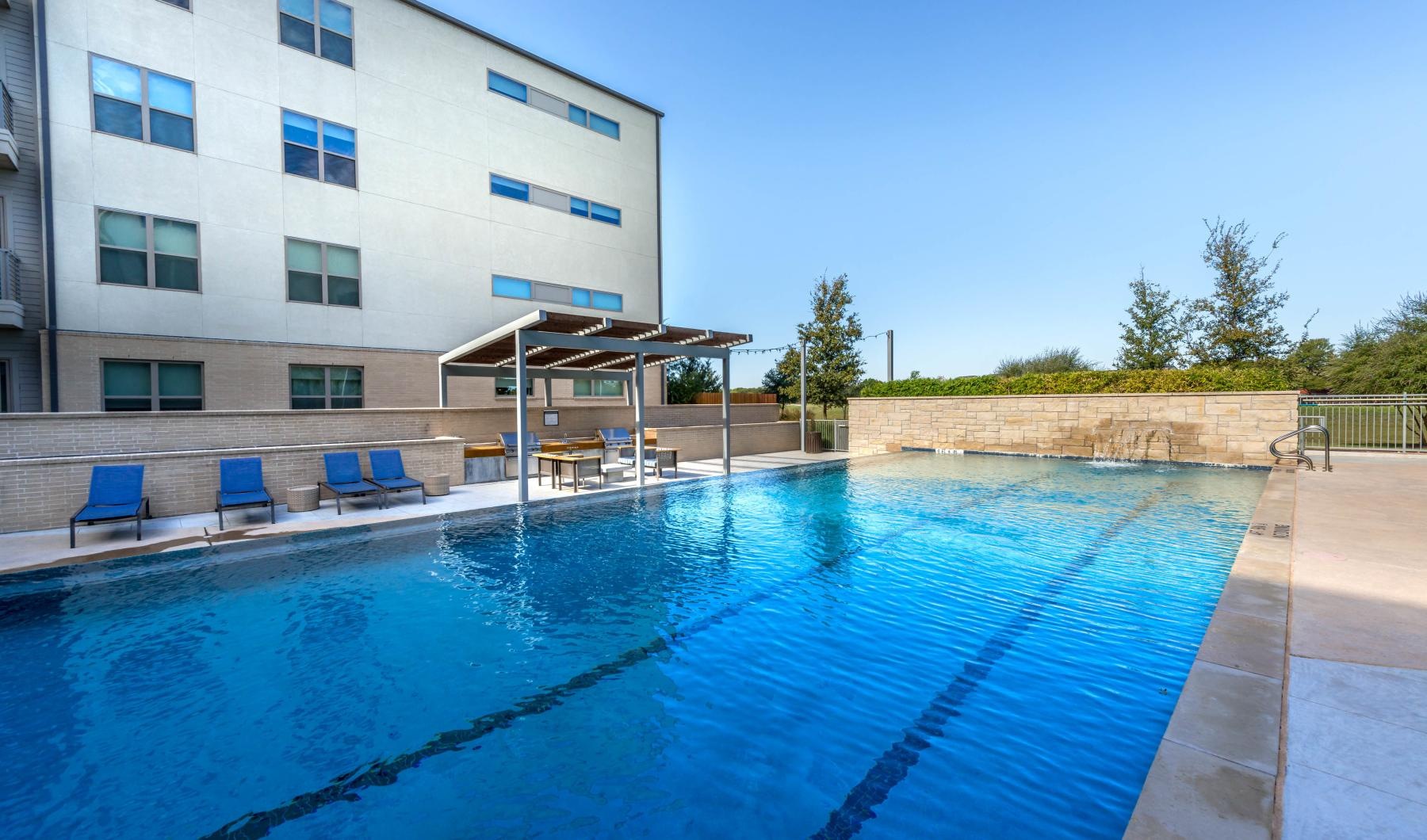 Sparkling swimming pool a swimming pool outside a building